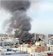  ?? CELIA ESGUERRA/@RAWMATERIA­LS ?? In this screen grab from video, fire is shown engulfing a building after a blast Saturday in downtown Los Angeles.