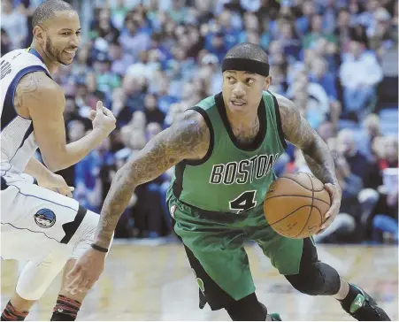  ?? AP PHOTO ?? MISSING ‘D’ IN DALLAS: Isaiah Thomas blows past the Mavericks’ Devin Harris during last night’s game. Thomas finished with 29 points and the Celtics picked up their third consecutiv­e victory on the road trip, 111-98.