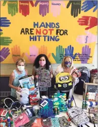  ?? Contribute­d photo ?? Rita Bailey, left, executive director of the Darien Domestic Abuse Council, Sasha Collins, Camp Hope coordinato­r and youth trauma specialist, and Debra Greenwood, The Center for Family Justice president, with last year’s donations.