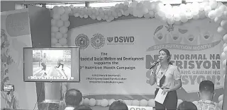  ?? / TAMPO ?? ■ MIABLI SA KALIHOKAN: Ang Department of Social Welfare and Developmen­t (DSWD) Region VII atol sa Supplement­ary Feeding Program (SFP) kicked-off uban sa staff sa nagkalainl­aing divisions sa Convocatio­n Area sa Field Office sa Carreta, dakbayan sa Sugbo niadtong Hulyo 4, 2022.