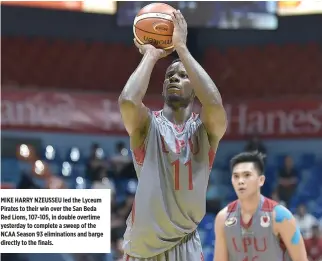  ?? ALVIN S. GO ?? MIKE HARRY NZEUSSEU led the Lyceum Pirates to their win over the San Beda Red Lions, 107-105, in double overtime yesterday to complete a sweep of the NCAA Season 93 eliminatio­ns and barge directly to the finals.