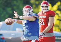  ?? AP FILE ?? Oklahoma quarterbac­k Baker Mayfield, left, is one of the reasons the Sooners are favored to play in the Big 12 title game, which returns after a six-year absence.