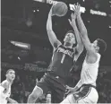  ??  ?? Suns coach Igor Kokoskov says the chances are “slim” that Devin Booker, above, plays Tuesday against Sacramento.