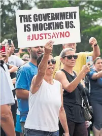  ?? SEAN KILPATRICK THE CANADIAN PRESS ?? Protesters gather as Liberal Leader Justin Trudeau makes a campaign stop in Nobleton, Ont., last month.