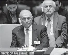 ?? Angela Weiss AFP/Getty Images ?? PALESTINIA­N officials Ziad abu Amr, front, and Riyad Mansour at the U.N. on Thursday. The membership bid won considerab­le support on the Security Council.