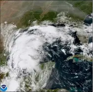  ?? NOAA VIA AP ?? This satellite image provided by NOAA shows Tropical Storm Nicholas in the Gulf of Mexico on Sept. 12. Tropical storm warnings have been issued for coastal Texas and the northeast coast of Mexico. Nicholas is expected to produce storm total rainfall of 5to 10inches, with isolated maximum amounts of 15inches, across portions of coastal Texas into southwest Louisiana Sunday, Sept. 12through midweek.