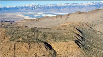  ?? Photo courtesy Friends of the Inyo ?? An aerial view of Conglomera­te Mesa, a roadless area on the edge of Death Valley National Park where Mojave Previous Metals is conducting explorator­y drilling in search of gold.