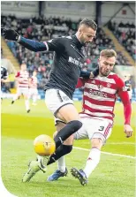  ??  ?? Dundee’s Marcus Haber evades Scott McMann