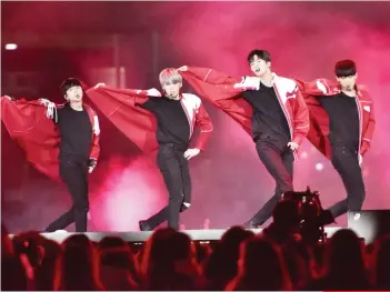  ??  ?? SF9 looking uncannily like matadors while performing their O Sole Mio song.