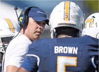  ?? STAFF PHOTO BY MATT HAMILTON ?? UTC football coach Rusty Wright talks to linebacker Kameron Brown during last Saturday’s game against East Tennessee State at Finley Stadium. The Mocs are on the road this week to face Virginia Military Institute.