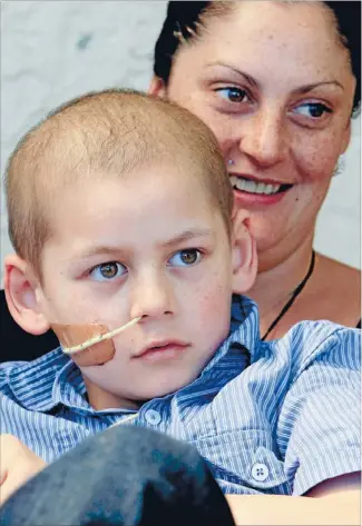  ?? Photo: COLIN SMITH/FAIRFAX NZ ?? See the Facebook page: Phoenix Treatment Appeal. The Phoenix Treatment Appeal account number is 03-0703-0829333-000. Battling on: Renea Pidduck with her son Phoenix Stafford, 9, of Nelson, who has Ewing’s sarcoma of the spinal cord.