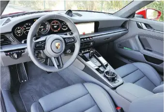  ??  ?? The 2020 Porsche 911’s interior provides most of the luxury and technology we’ve come to expect from the brand.