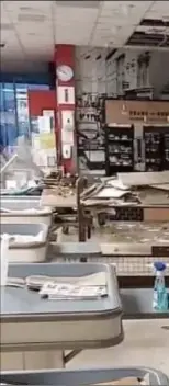  ??  ?? Ceiling collapse in Pettitt’s Super Valuafter heavy rain on Tuesday evening.