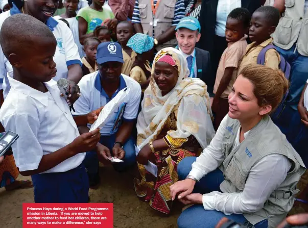  ??  ?? Princess Haya during a World Food Programme mission in Liberia. ‘If you are moved to help another mother to feed her children, there are many ways to make a difference,’ she says
