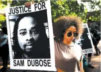  ?? ASSOCIATED PRESS FILE PHOTO ?? Protesters gather for a demonstrat­ion on the University of Cincinnati campus last month demanding a white former police officer be tried a third time in the fatal shooting of an unarmed black motorist in Cincinnati.