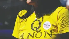  ?? Elijah Nouvelag e / REUTERS ?? A supporter of U. S. President Donald Trump wears
a Qanon shirt in Georgia in September.