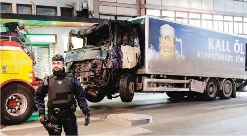  ??  ?? STOCKHOLM: Photo shows the truck that crashed into the Ahlens department store at Drottningg­atan in central Stockholm. — AFP (See page 10)