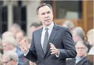  ?? ADRIAN WYLD THE CANADIAN PRESS FILE PHOTO ?? Finance Minister Bill Morneau met Canadian business leaders on Friday, many of whom are watching how he responds to competitiv­e challenges created when the U.S. tax rate was slashed to 21 per cent from 35 per cent.