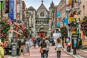  ??  ?? Exploring Grafton Street, a popular place to shop and try whiskey in Dublin