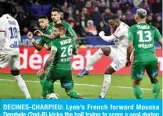  ??  ?? DECINES-CHARPIEU: Lyon’s French forward Moussa Dembele (2nd-R) kicks the ball trying to score a goal during the French L1 football match between Olympique Lyonnais (OL) and AS Saint-Etienne (ASSE) at the Groupama stadium in Decines-Charpieu, central-eastern France. — AFP