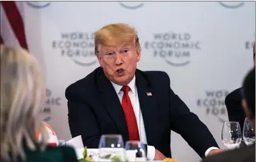  ?? ANNA MONEYMAKER — THE NEW YORK TIMES ?? President Donald Trump speaks with global chief executive officers at the World Economic Forum on Tuesday.