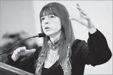  ?? Herald photo by Ian Martens @IMartensHe­rald ?? Matchmaker Sandra Juell answers a question during the Valentine’s Day meeting of the Southern Alberta Council on Public Affairs.