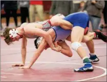  ?? NATE HECKENBERG­ER - FOR DIGITAL FIRST MEDIA ?? Owen J. Roberts’ Connor Quinn, top, rides Neshaminy’s Colton Jordan during the 126-pound fifth-place match Sunday at the Southeast AAA Regional.