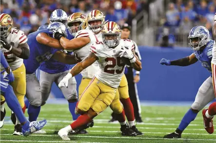  ?? Lon Horwedel / Associated Press ?? In his NFL debut, 49ers running back Elijah Mitchell, a sixth-round draft choice, carried 19 times for 104 yards and a TD.