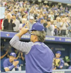  ??  ?? Blue Jays manager John Gibbons tips his cap to Toronto fans after his last game at the Rogers Centre Wednesday, a 3-1 win over the Houston Astros.