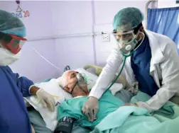  ??  ?? DOCTORS attend to a COVID-19 patient in the intensive care unit of a hospital in Sanaa, Yemen, on June 14.