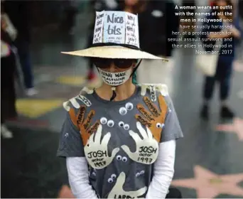  ??  ?? A woman wears an outfit with the names of all the men in Hollywood who have sexually harassed her, at a protest march for sexual assault survivors and their allies in Hollywood in November, 2017