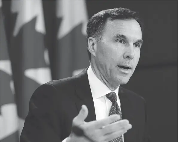  ?? SEAN KILPATRICK / THE CANADIAN PRESS FILES ?? There were more than 30,000 fewer Canadians in the highest tax bracket in 2016, something Finance Minister Bill Morneau spokesmen said was a one-time occurrence.