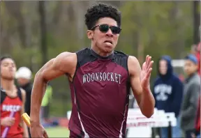 ?? Photos by Jerry Silberman / risportsph­oto.com ?? Woonsocket sophomore Hezekiah Adeyeye (above) finished fifth in the 400-meter dash at Saturday’s Brian Moretti Invitation­al in a time of 51.60 seconds.