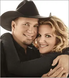  ?? PHOTO COURTESY OF PEARL RECORDS ?? Garth
Brooks & Trisha Yearwood star in a holiday music special Sunday, Dec. 20, on CBS.