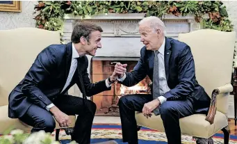  ?? | Reuters ?? US PRESIDENT Joe Biden with French President Emmanuel Macron in the Oval Office at the White House in Washington, yesterday.