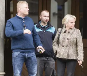  ?? Pic: Donal Hackett. ?? (L-R) Mr Konrad Mancawicz, a friend, and Mrs Violette Flisak, widow of the deceased leaving Sligo Courthouse after his inquest on Monday.