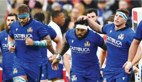  ??  ?? Threat: Italy’s players celebrate a try against France in their 35-22 loss at the Stade de France