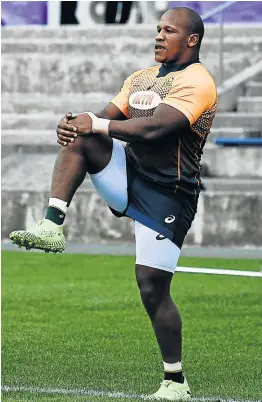  ?? Picture: AFP/ ANNE-CHRISTINE POUJOULAT ?? LIMBERING UP: Bongi Mbonambi takes part in a training session at the Arcs Urayasu Park in Urayasu, ahead of the Boks’ quarter final clash with hosts Japan on Saturday.