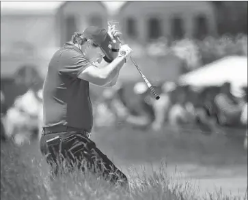  ?? Carolyn Kaster Associated Press ?? ON THE WAY to his worst U.S. Open round, an 11-over-par 81, Phil Mickelson reacts to a shot out of the high grass on the fifth hole. The strangest moment of the round would come eight holes later for Mickelson.