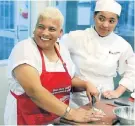  ?? Picture: BERNA WALTERS ?? ITALIAN SIZZLE: Anthea Barends Metter, left, and Melani Potgieter prepare an Italian dish at The Herald Cooking Masterclas­s held at Capsicum Culinary Studio in Newton Park last Thursday