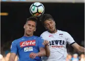  ?? AFP ?? Napoli’s Arkadiusz Milik ( left) vies for the ball with Andrea Barberis of Crotone in their Serie A match on Monday. Napoli won 2- 1. —