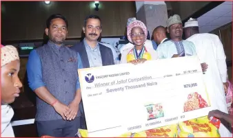  ??  ?? Winner of the star prize, Aisha Mansur of First Grade Internatio­nal School holding a cheque of N150,000 presented to her by officials of Vascorp and the Kano chapter of Rice Farmers Associatio­n of Nigeria that organised the cooking competitio­n for children aged between 12 to 15 years in Kano… recently