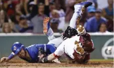  ?? CHARLES KRUPA/THE ASSOCIATED PRESS ?? Toronto’s Josh Donaldson, left, scores on a Kendrys Morales single in the third inning. Boston chased Marco Estrada in the bottom of the inning.