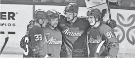  ?? MATT KARTOZIAN/USA TODAY SPORTS ?? Coyotes center Jack McBain, second from right, celebrates with teammates after scoring a goal. The franchise appears to be moving after its final regular-season game on Wednesday in Tempe, Ariz.