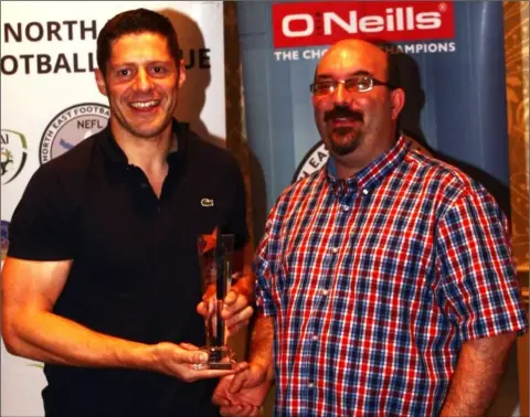  ??  ?? Derek Delaney of Rock Celtic accepts the Division 1 Player of the Year award from NECSL PRO Jonathan Purvis.