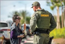  ?? PHOTOS BY JEFF ANTENORE ?? Sandria Chou said her parents were inside Geneva Presbyteri­an Church in Laguna Woods when a shooter opened fire.