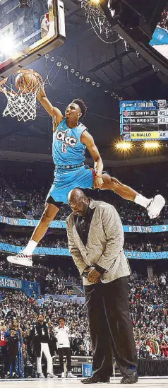  ?? AFP ?? Hamidou Diallo of the Oklahoma City Thunder dunks the ball over Shaquille O’Neal during the 2019 AT&amp;T Slam Dunk Contest as part of the State Farm All-Star Saturday Night at the Spectrum Center in Charlotte, North Carolina.