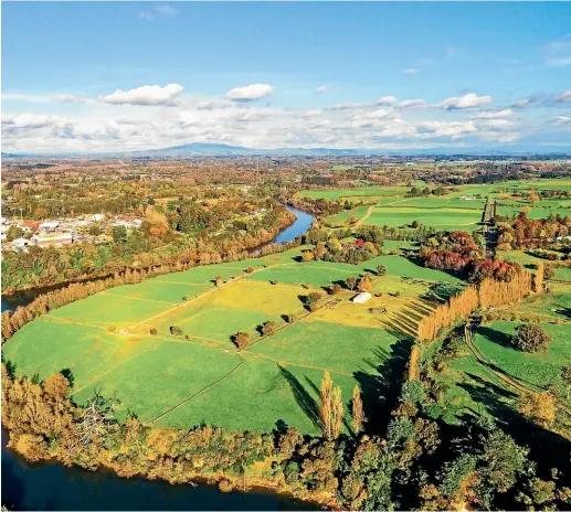  ??  ?? The Amberfield developmen­t in the Peacocke area, pictured on the right of the Waikato River, would house thousands of new homes.