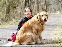  ?? PHOTO COURTESY OF MARIE HAIGH – FOR MEDIANEWS GROUP ?? Brooke Haigh, 9, poses for a photo with her dog Clover while on the Schuylkill River Trail in Pottstown.