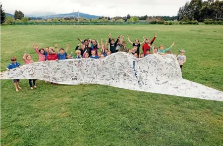  ?? PHOTO: DAVID JAMES/STUFF ?? Pupils from Wairau Valley School are ready for Thursday’s America’s Cup parade in Picton. Cynthia Brooks, councillor